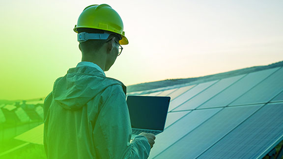 man-working-laptop-solarpower-plant